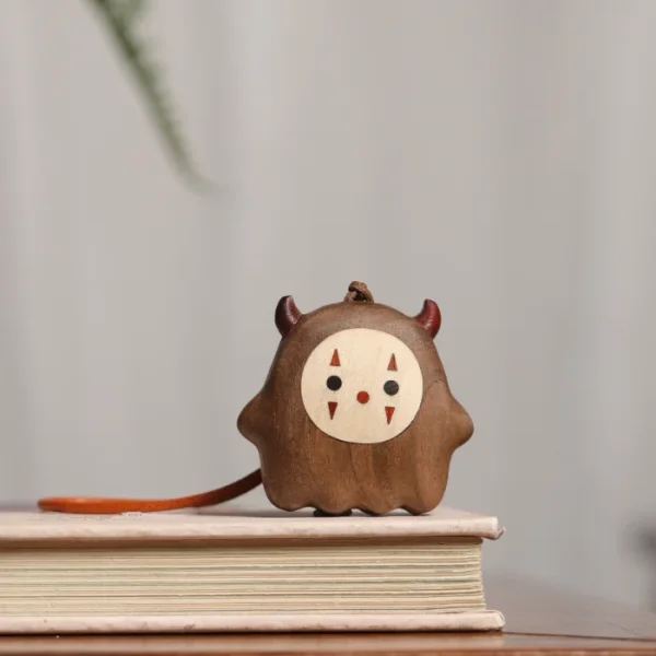 Creative walnut wood bag charm featuring a cute little devil design