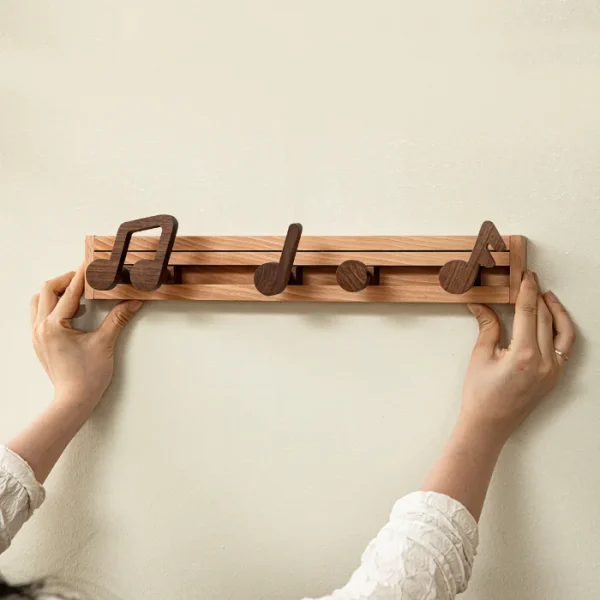 Creative coat rack with music note-shaped hooks, adding a fun and functional touch to your home