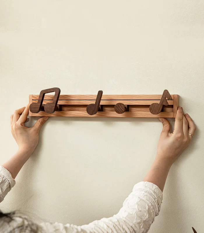 Creative coat rack with music note-shaped hooks, adding a fun and functional touch to your home