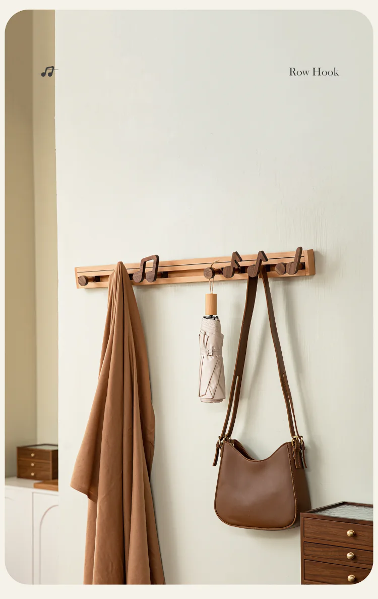 A charming wall rack with wooden music note hooks, combining storage and decor in one piece