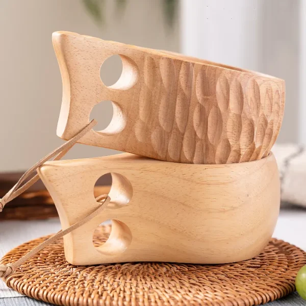 A beautifully handcrafted wooden cup featuring a distinctive double-hole handle for ergonomic grip