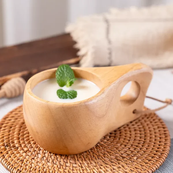 Stylish and functional kuksa mug made of natural wood with a smooth round hole handle design