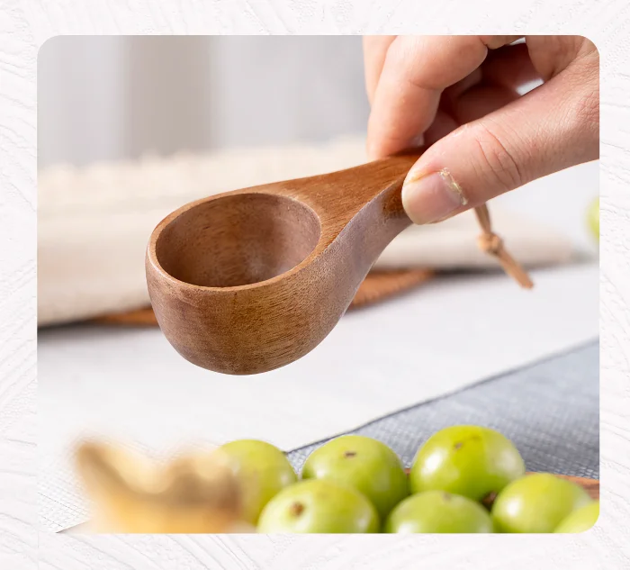 A charming wooden duo featuring a tiny cup and spoon, great for kids or decorative use