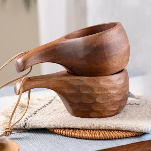 Handcrafted kuksa cup with ergonomic handle, ideal for outdoor adventures or rustic home use